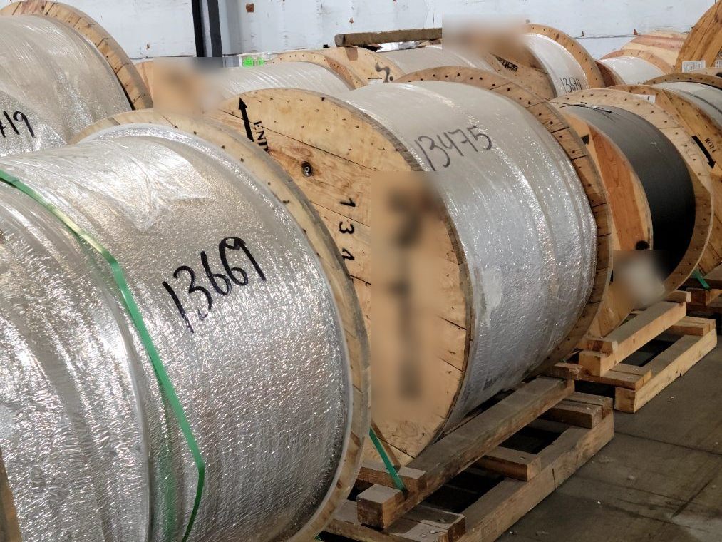 Cable reels on pallets in storage