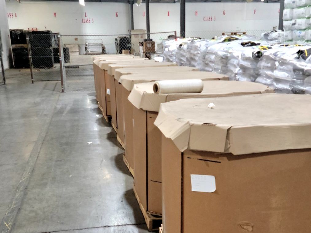 Freight on pallets staged inside the Fast Distribution warehouse